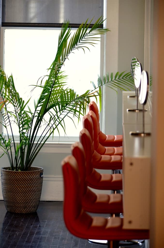 A modern hair salon interior with styling chairs